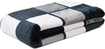 A folded blanket with a checkered pattern of dark gray, light gray, and white squares.