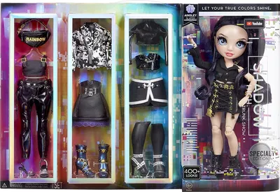 A Rainbow High fashion doll and her accessories are displayed in a retail box. The box is divided into compartments showcasing the doll and various outfits and accessories.