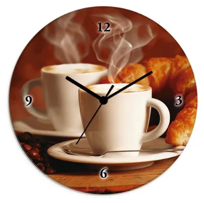 A clock face featuring a steaming cappuccino and croissants.