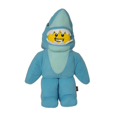 A plush toy of a LEGO minifigure dressed in a shark costume.