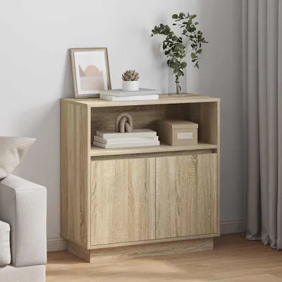 A wooden sideboard with two doors and an open shelf, decorated with books, a plant, and a framed picture.