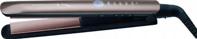 A rose gold and black hair straightener is shown against a white background.