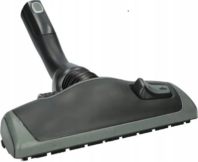 A vacuum cleaner floor head attachment, shown from a three-quarter angle against a white background.