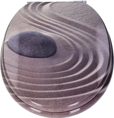 A top-down view of a toilet seat with a zen garden design.