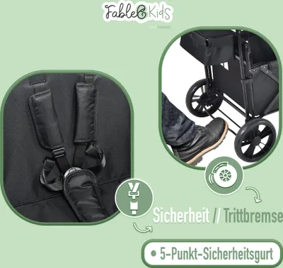 Close-up of a stroller seat harness and a foot operating a brake on a stroller.