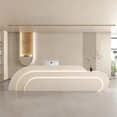 A modern reception desk in a clean, minimalist setting.