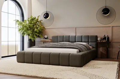 A modern bedroom with a large bed, plants, and decorative lighting.
