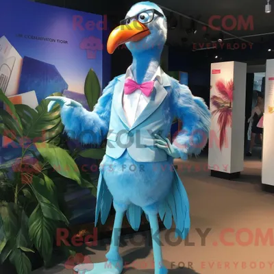 Produktbild von Maskottchenfigur REDBROKOLY eines blauen Flamingos mit Bikini und Krawattennadeln