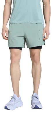 Immagine prodotto di PUMA Pantaloncini da uomo e da donna M Move 2IN1, modello con tessuto tecnico, colore Green Moon