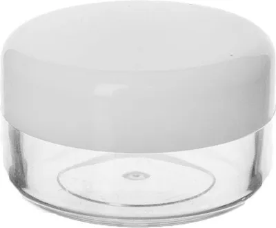 A clear studio shot of a small, empty cosmetic container with a white lid and a clear plastic base.