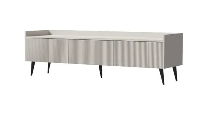 A beige TV lowboard with fluted fronts and black legs, isolated on a white background.