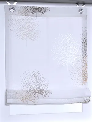 A white roman blind with a tree pattern is shown hanging in a window.