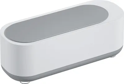 A white and gray ultrasonic cleaner is shown from a slightly elevated side angle against a white background.