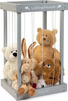 A wooden box with strings holding stuffed animals inside.