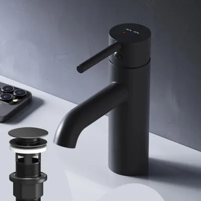 A black faucet and pop-up drain assembly are displayed on a white surface against a gray background.
