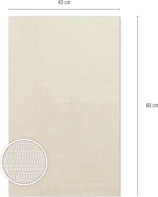 A flat lay of a beige rug with a close-up inset showing the texture.