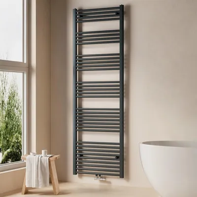 A modern bathroom with a dark anthracite towel radiator, a wooden stool with a towel, and a white bathtub.