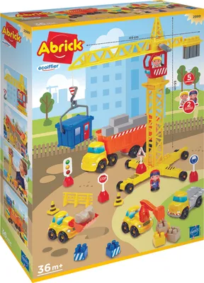 A toy construction site playset with a crane, trucks, and figures, depicted on the product packaging.