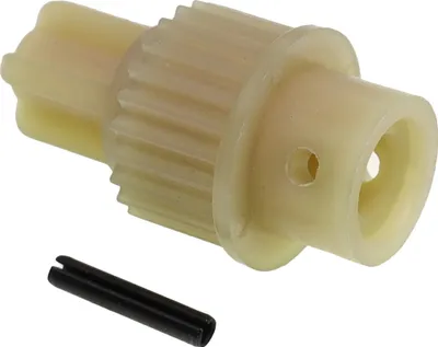 A cream-colored gear and a black pin are shown against a white background.