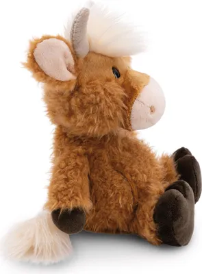 A side view of a plush toy Highland cow sitting down.