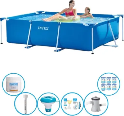 A rectangular frame swimming pool with people in it, surrounded by various pool accessories.
