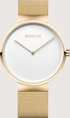 A close-up shot of a gold Bering watch with a white face.