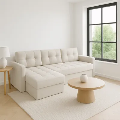 A minimalist living room with a sectional sofa and a round coffee table.