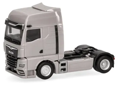 Zdjęcie produktu dla Model ciężarówki Herpa Man TGX GX – ciągnik siodłowy, 2-osiowy, miniatura w skali 1:87, szary, wyprodukowany w Niemczech