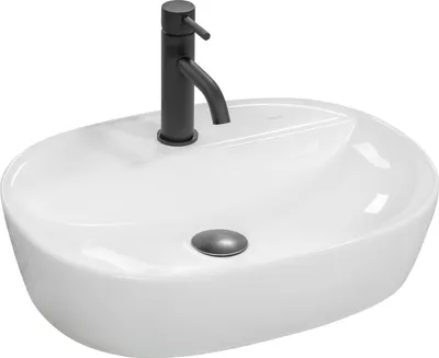 A white oval countertop sink with a black faucet and a gray drain.