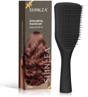 Image de Brosse démêlante pour cheveux, avec des picots souples et flexibles, utilisable sur cheveux mouillés ou secs, et offrant un massage du cuir chevelu