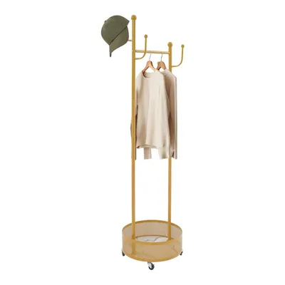 A gold coat rack with a green cap and two beige sweaters hanging on it, set against a white background.