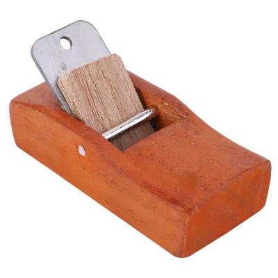 A small wooden hand plane with a metal blade, isolated on a white background.