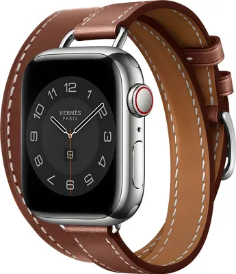 A close-up studio shot of an Apple Watch with a brown leather double tour strap.