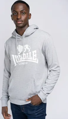 A man wearing a gray Lonsdale London hoodie and blue jeans, standing against a white background.