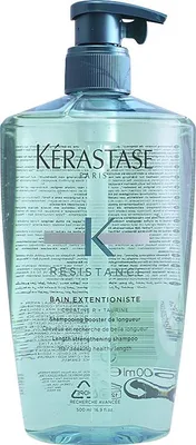A bottle of Kerastase shampoo with a pump dispenser.