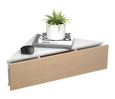 A white triangular corner shelf with a wooden drawer front, a potted plant, and two books.