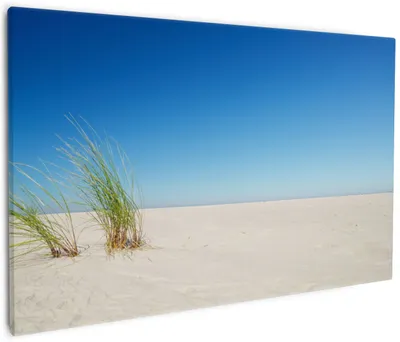 Produktbild von Wallario Premium Leinwandbild Sandstrand unter blauem Himmel in Größe 60 x 90 cm