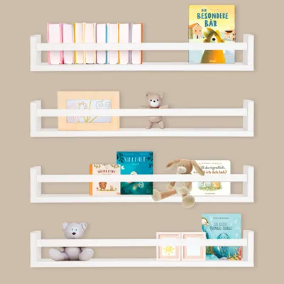 Four white wall shelves are mounted on a light brown wall, displaying books and decorative items.