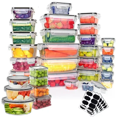 A collection of clear plastic food storage containers filled with various colorful fruits, vegetables, and other food items, arranged in a stacked display against a white background.