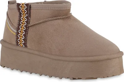 A close-up studio shot of a single taupe boot.
