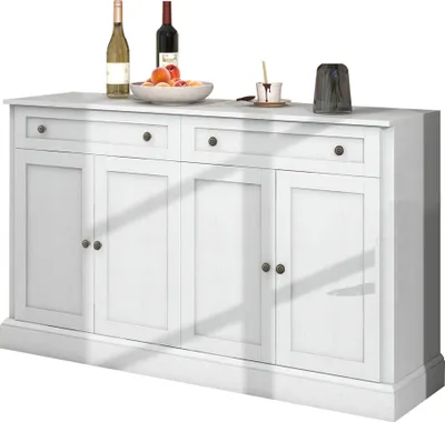 A white sideboard with four doors and two drawers, displayed against a white background. There are two bottles of wine, a bowl of fruit, and a small cup with a spoon on top of the sideboard.
