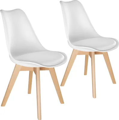 Two white dining chairs with light wood legs are shown against a white background.