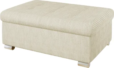 A beige upholstered ottoman with a tufted top and a ribbed texture on the sides, resting on small silver feet.
