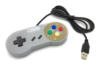 A gray USB game controller with colored buttons and a black cable, shown on a white background.