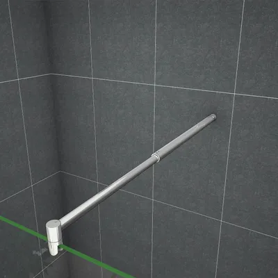 A close-up view of a shower screen stabilizer bar mounted on a tiled wall and glass panel.