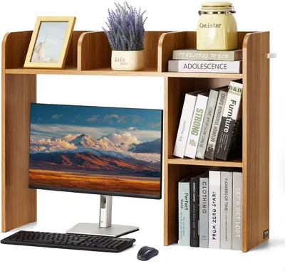 A wooden desk organizer with a monitor, keyboard, and mouse on a desk.
