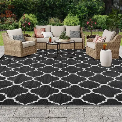 Imagen del producto de Alfombra de suelo reversible, fabricada con un material plástico ligero, de 180 x 270 cm, ideal para jardín y camping