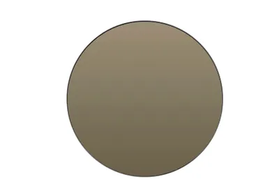 A round mirror with a dark frame against a white background.