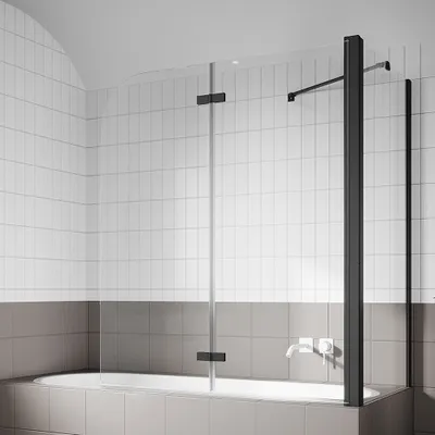 A modern bathroom with a bathtub and a glass shower screen.