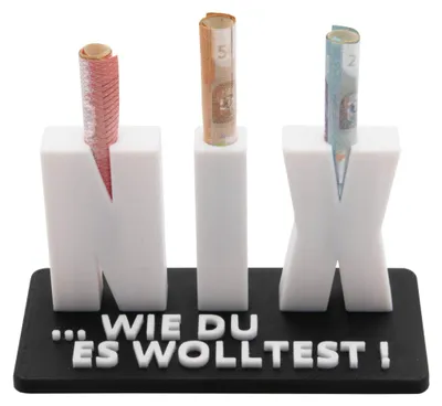 A 3D printed object holding rolled-up banknotes, with text on the base.
